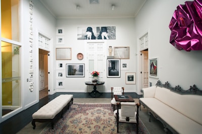 A beautifully arranged display of elegant wall art and table sculptures in a cozy living room setting.