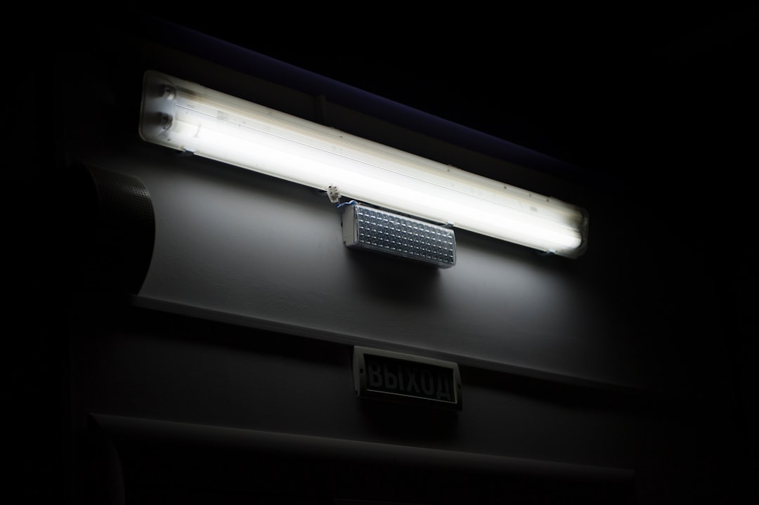 A long fluorescent lamp in a dark interior