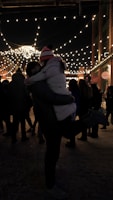A romantic couple sharing a dance under twinkling lights.