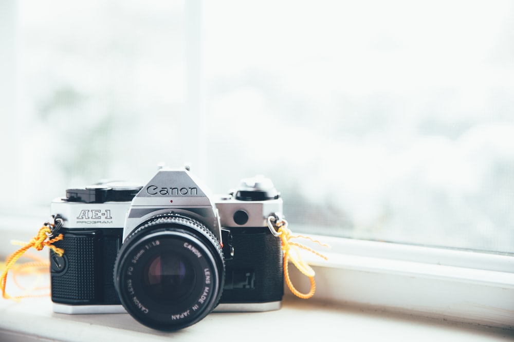 Canon SLR camera on window