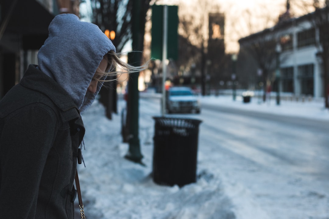 shallow focus photography of man looking down