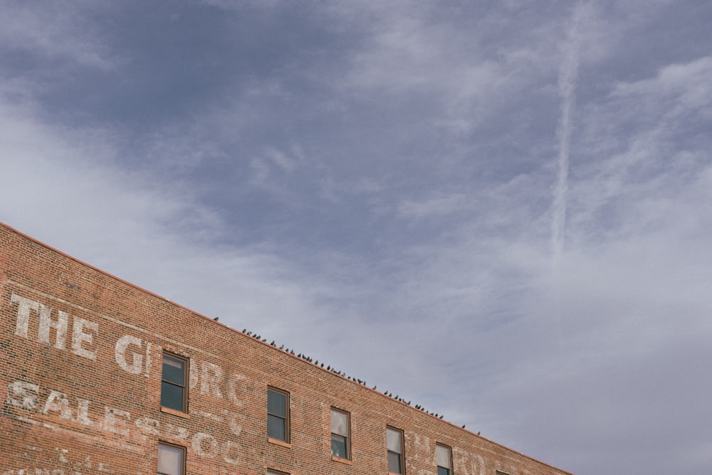 red concrete building under white clouds