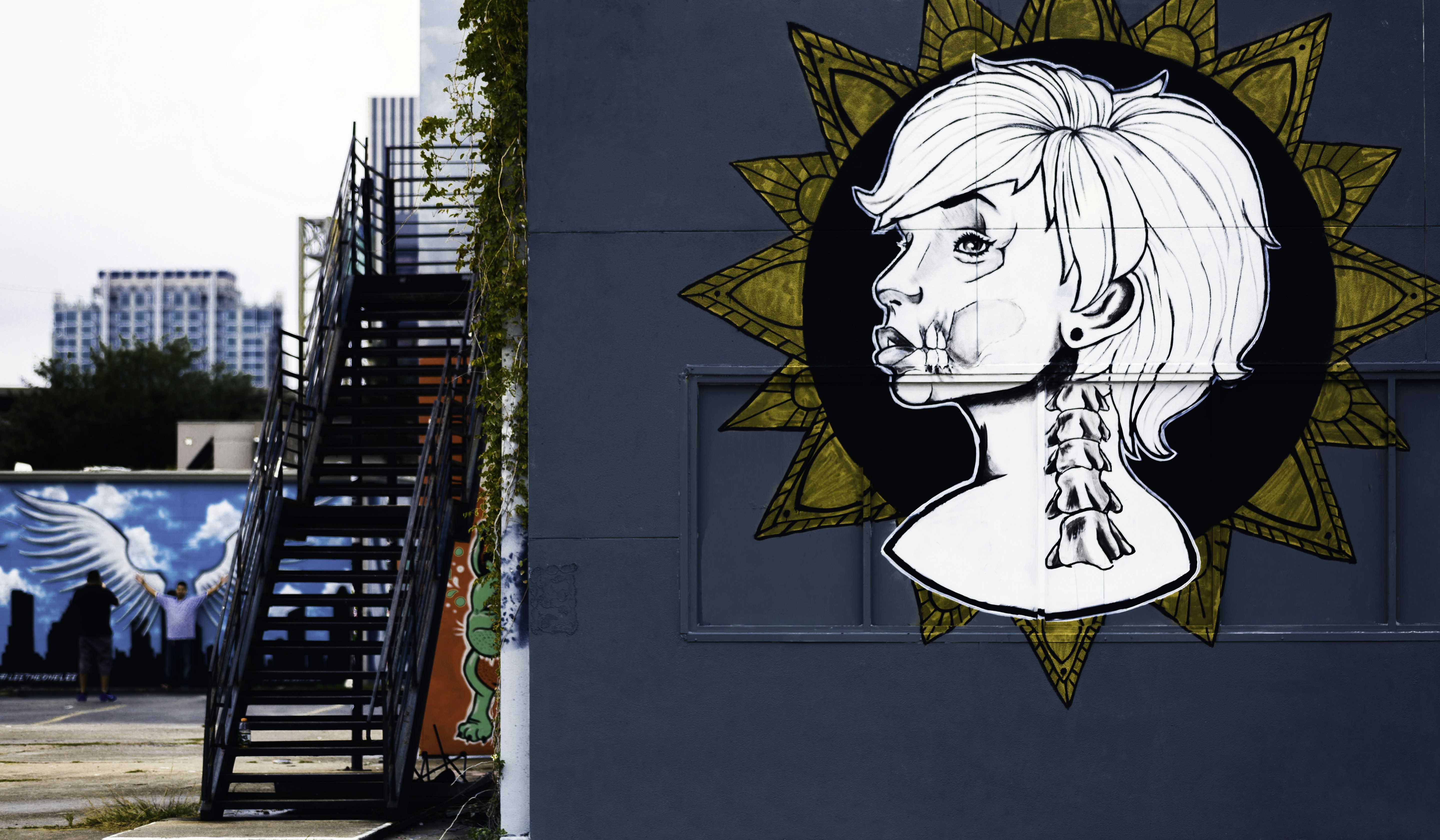 woman portrait painting on wall, Mural beside staircase