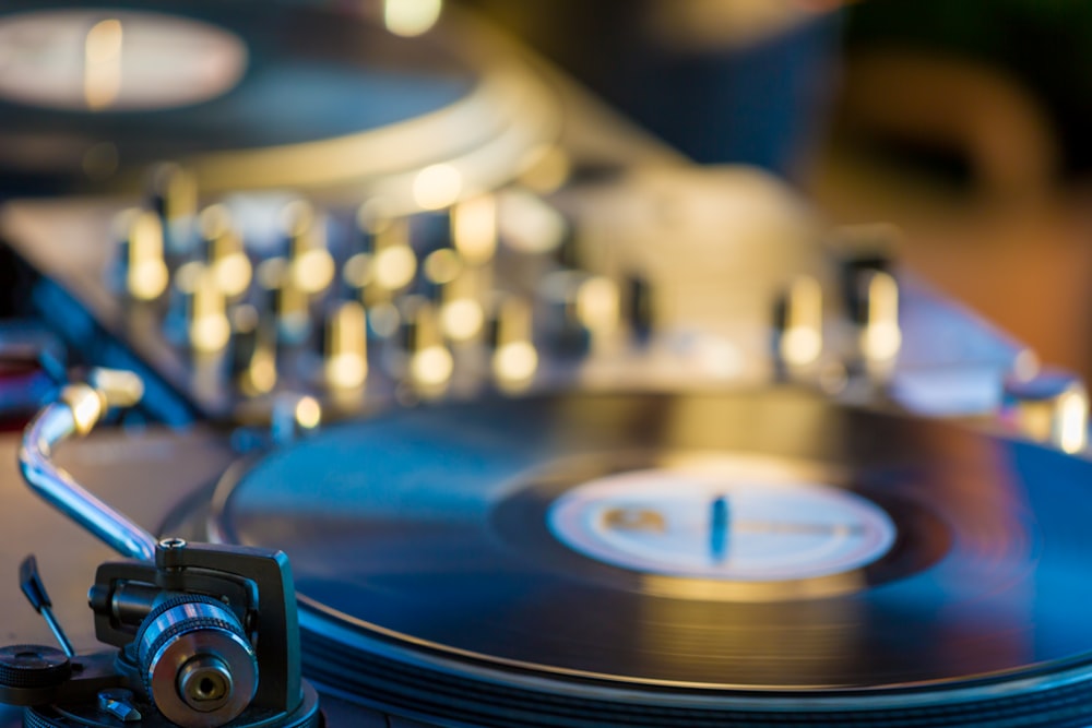 selective focus photography of black vinyl player