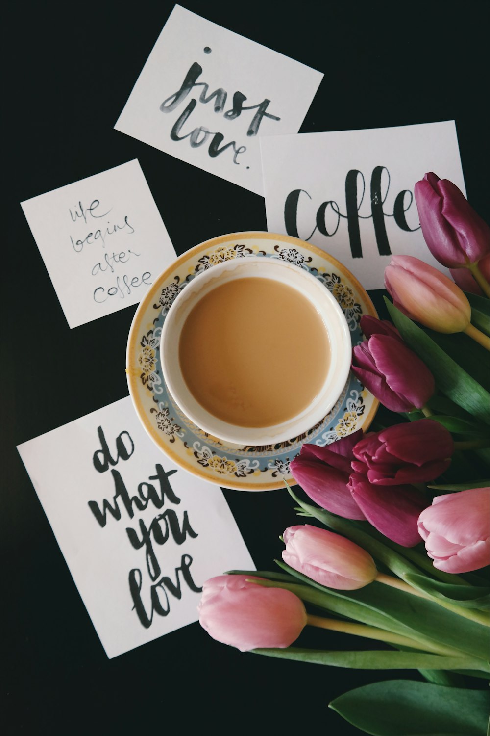 Motivational notes next to a cup of coffee.
