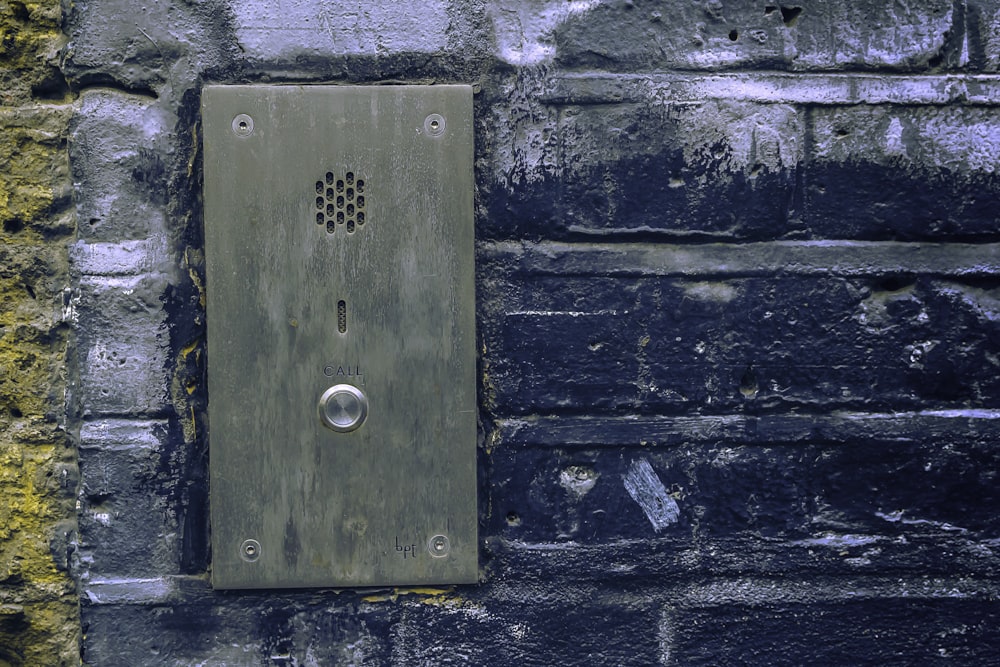 close-up photo of grey door bell