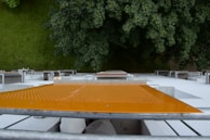 View from below showing multiple layers of safety nets protecting a building facade.