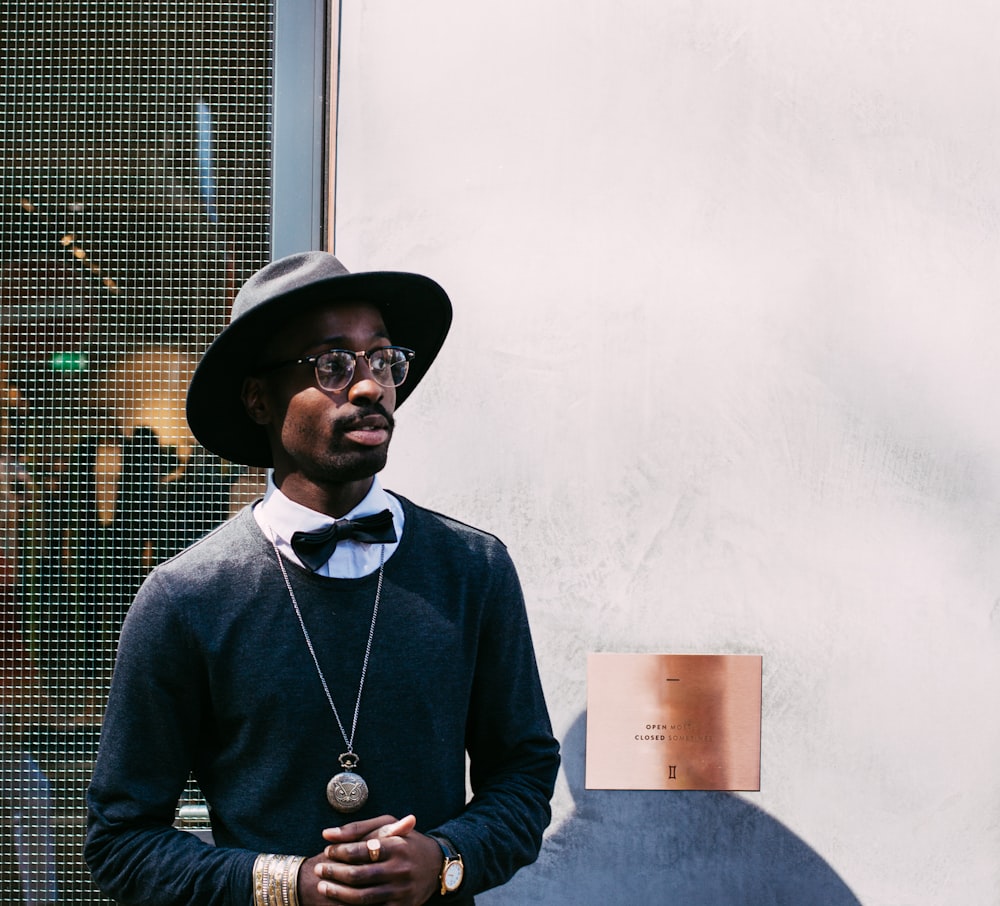 man in black sweatshirt and hat