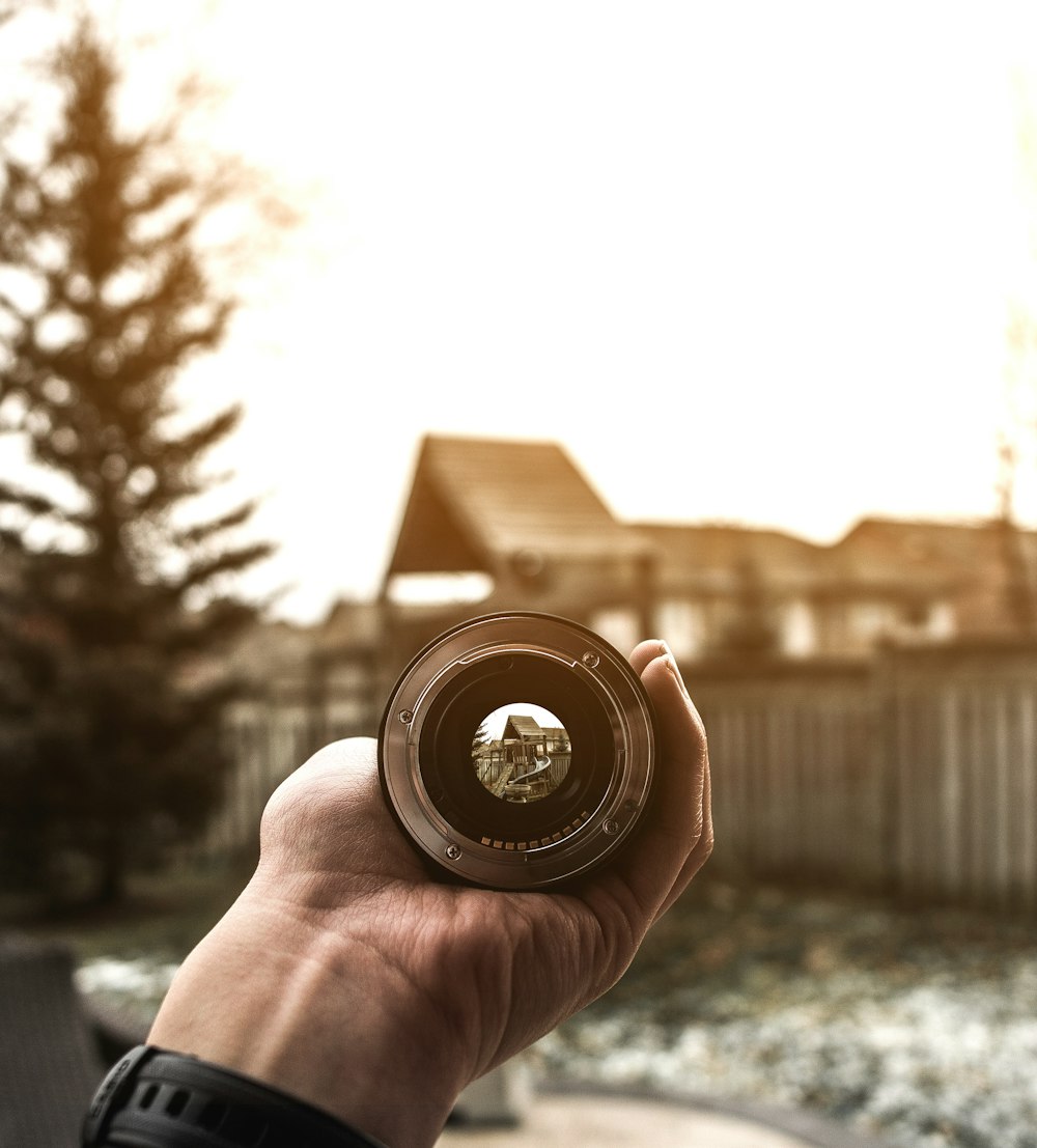 person holding telescope