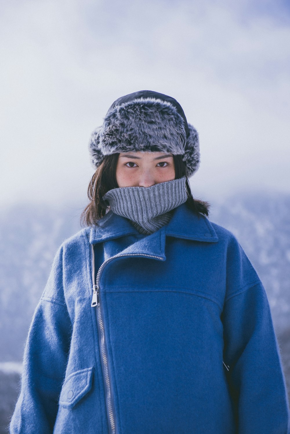 woman in blue jacket