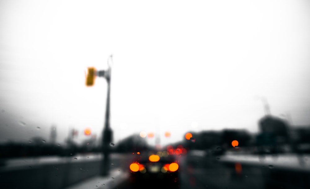 a blurry photo of a city street with traffic lights