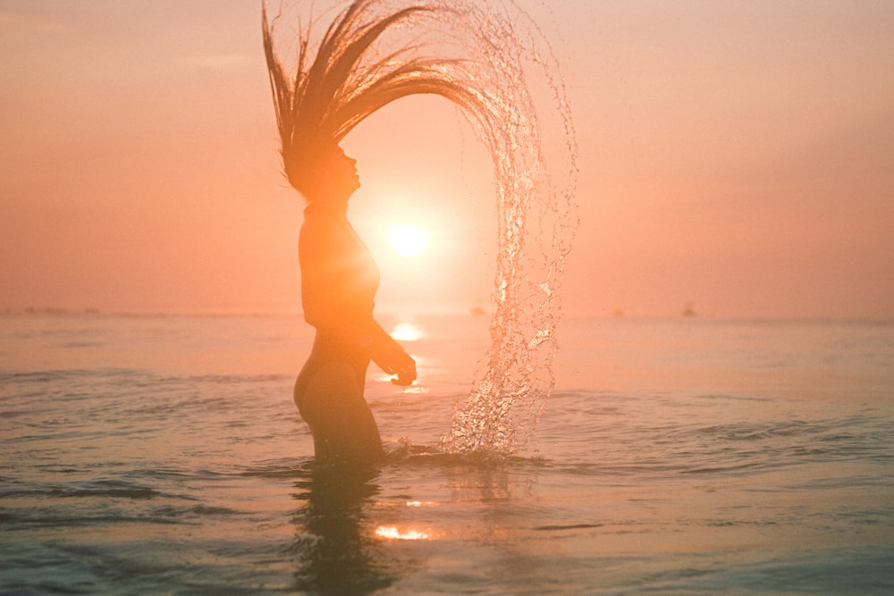 silhouette photo of woman against sunlight