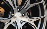 shallow focus photography of vehicle wheel