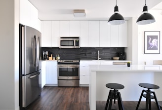 gray steel 3-door refrigerator near modular kitchen