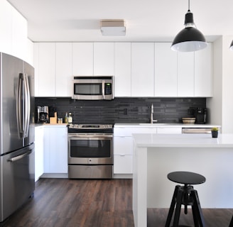 gray steel 3-door refrigerator near modular kitchen