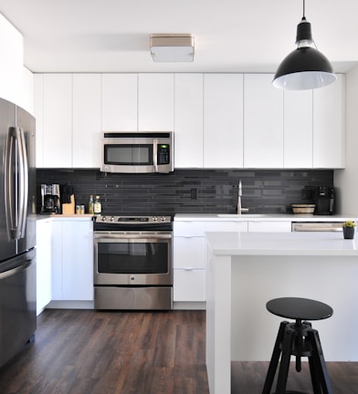 gray steel 3-door refrigerator near modular kitchen