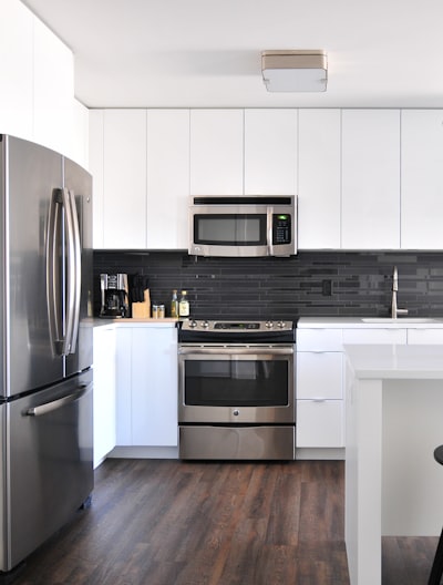 gray steel 3-door refrigerator near modular kitchen