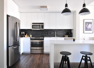 gray steel 3-door refrigerator near modular kitchen