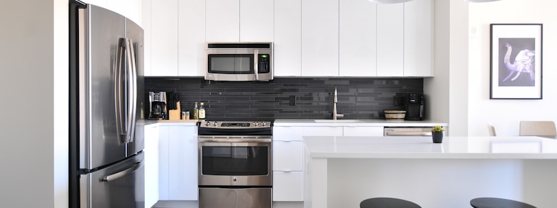 gray steel 3-door refrigerator near modular kitchen