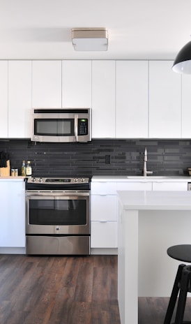 gray steel 3-door refrigerator near modular kitchen