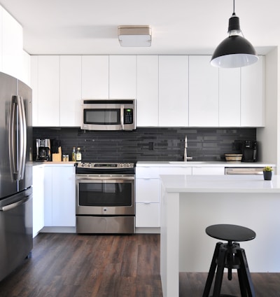 gray steel 3-door refrigerator near modular kitchen