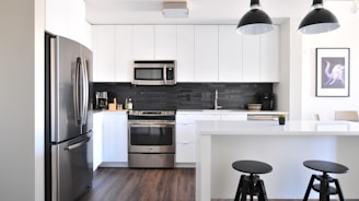 gray steel 3-door refrigerator near modular kitchen