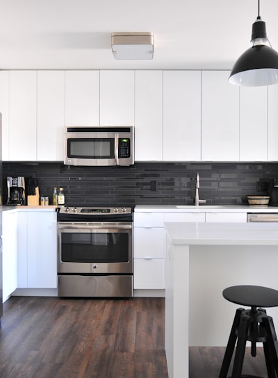 gray steel 3-door refrigerator near modular kitchen