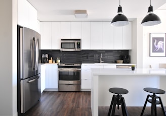 gray steel 3-door refrigerator near modular kitchen