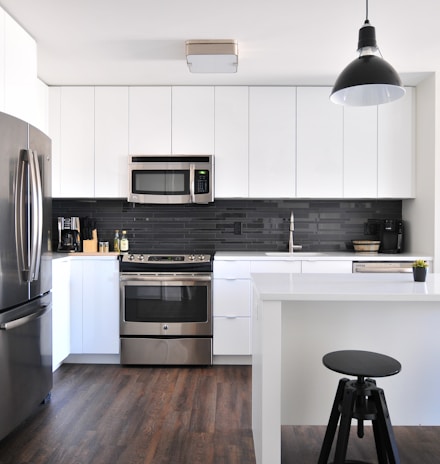 gray steel 3-door refrigerator near modular kitchen