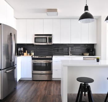 gray steel 3-door refrigerator near modular kitchen