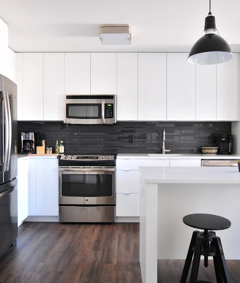 gray steel 3-door refrigerator near modular kitchen