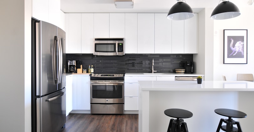 gray steel 3-door refrigerator near modular kitchen