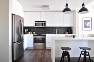 gray steel 3-door refrigerator near modular kitchen decor google meet background