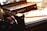 A close-up image of a student studying with a laptop and notebooks, focused on learning.