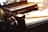 A close-up image of a student studying with a laptop and notebooks, focused on learning.