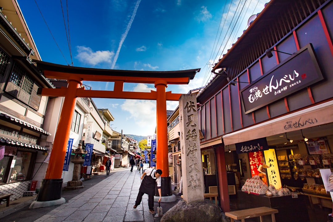 man standing beside storefront, Travel in OSAKA in the morning. and i love travel more place on japan.<p></figure>hope u like this place and this photo.