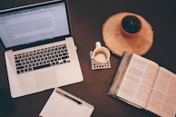 A neat workspace with law books, a notepad, and a cup of coffee