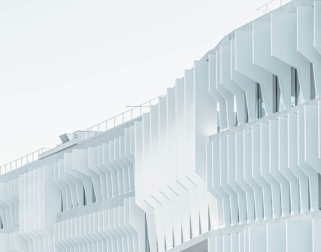 white high-rise building over cloudy sky at daytime, Madrid building facade