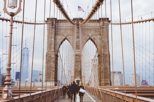 people walking on Brooklyn Bridge during daytime in Brooklyn Bridge United States
