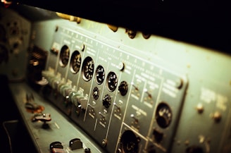 selective focus photography of grey electronic control panel