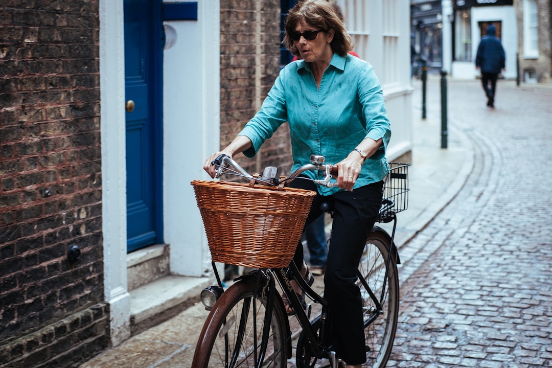 woman riding on bicycle on the street