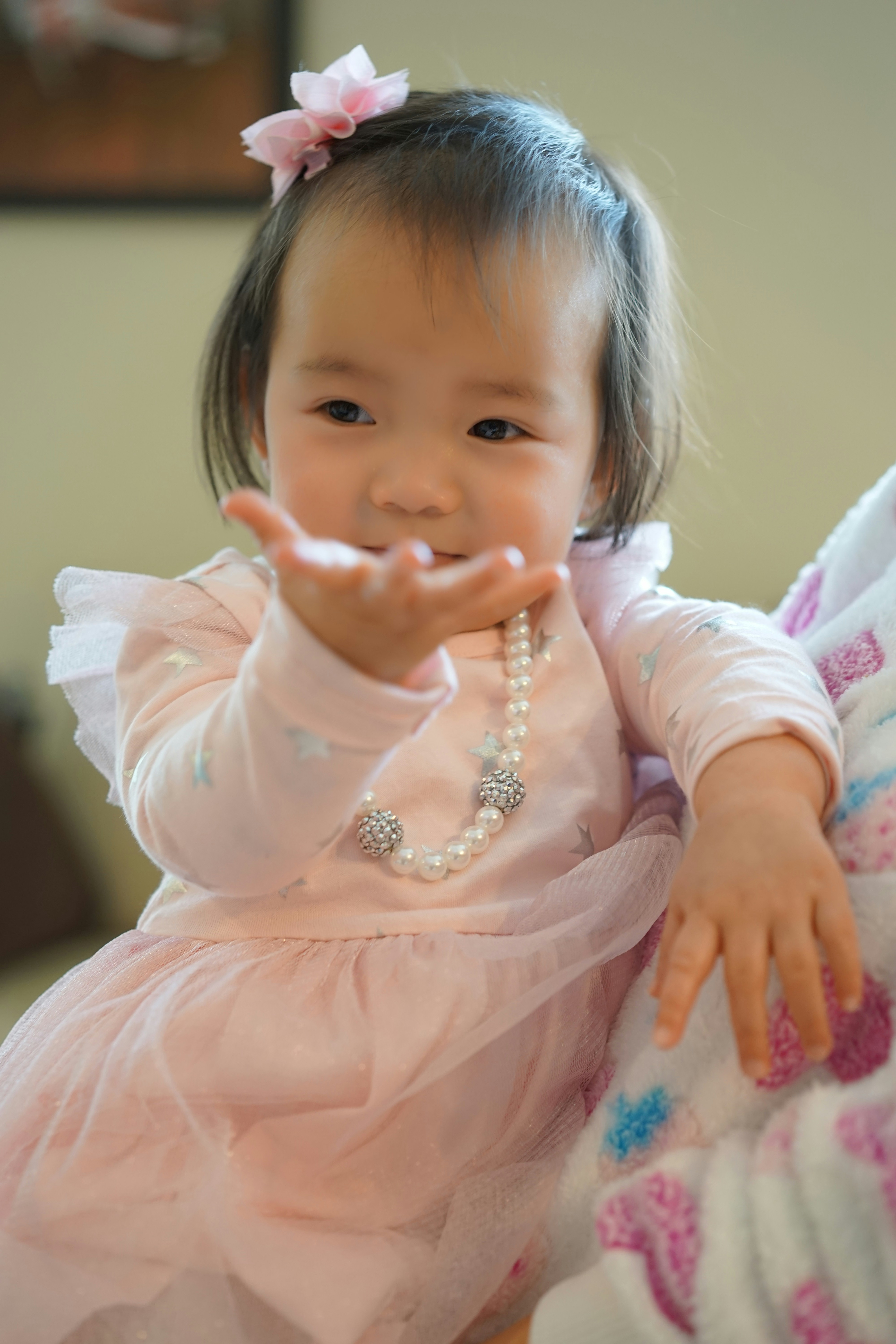 Cute baby wearing delicate gold bracelet