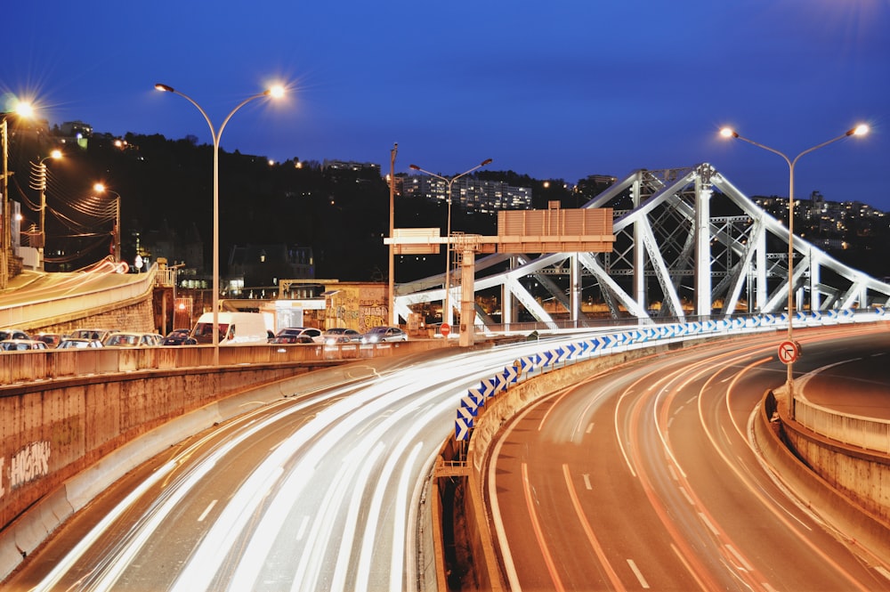 time-lapse photography of vehicles on roadway