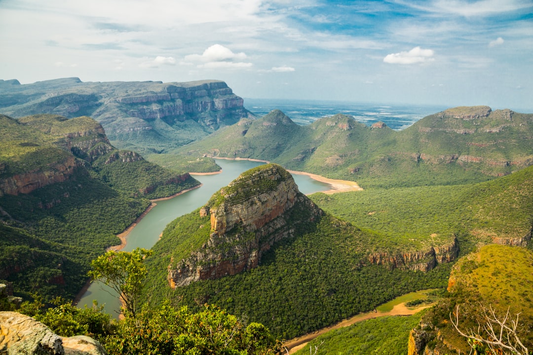 landscape photography of mountains under blue sky