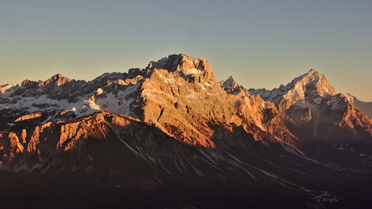 landscape photography of mountain under clear blue sky in Cortina d'Ampezzo Italy