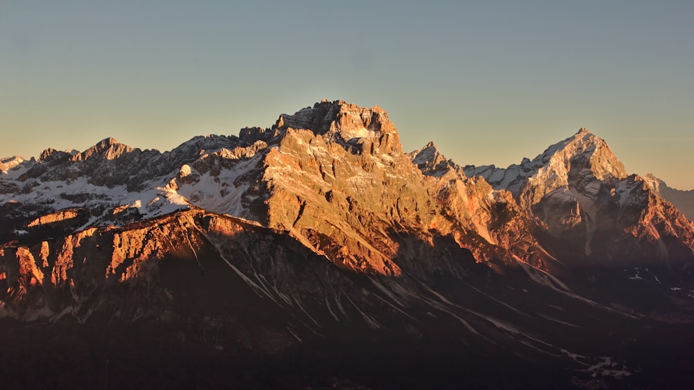 landscape photography of mountain under clear blue sky