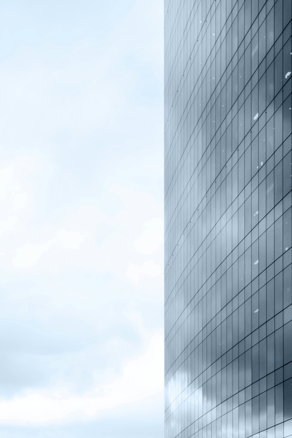 a tall building with a sky background