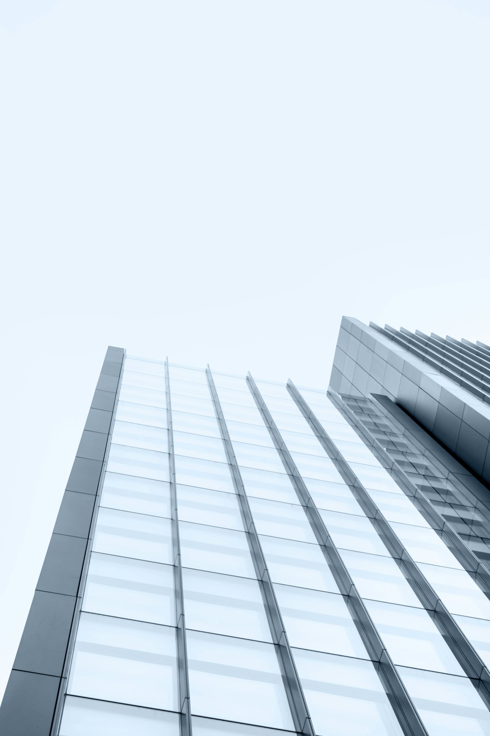 low-angle photography of glass high rise building