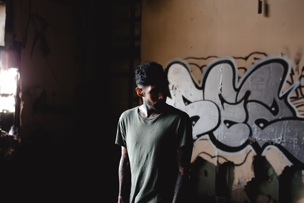 man standing in front of wall