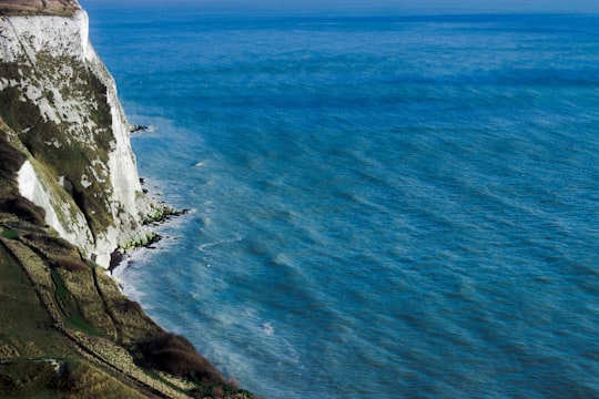 aerial photography of mountain cliff beside seashore during daytime in South Foreland Heritage Coast United Kingdom